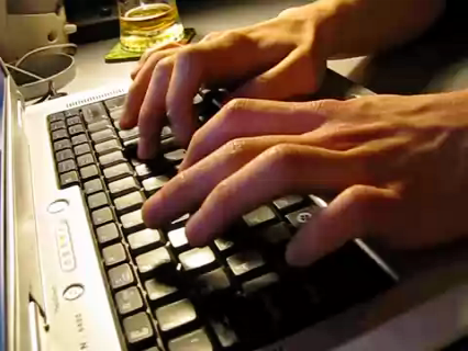 Entrepreneur typing to register a private company online in South Africa