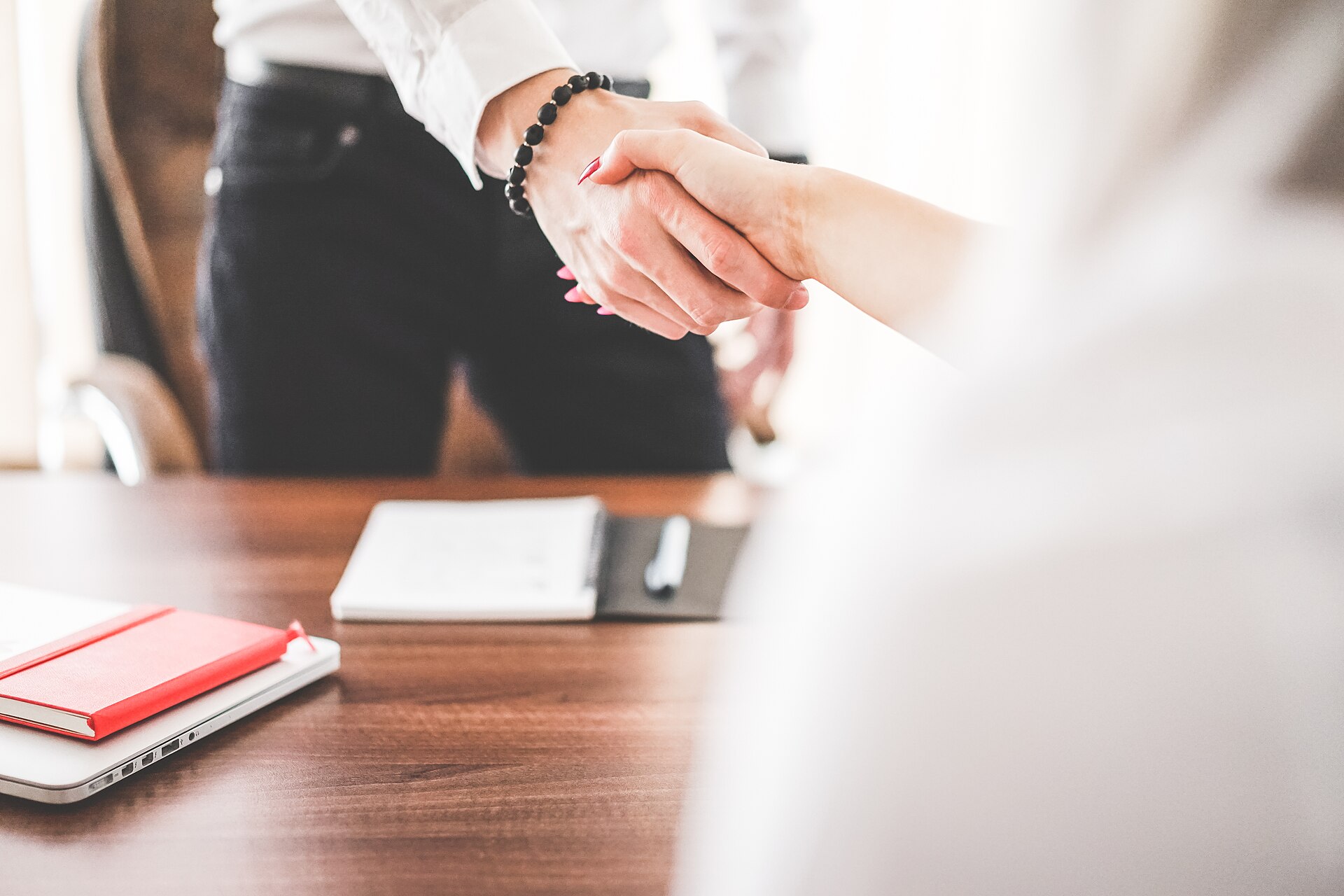 How to Register a Private Company (Pty) Ltd Online in South Africa 1 Business partners shaking hands after signing company registration documents